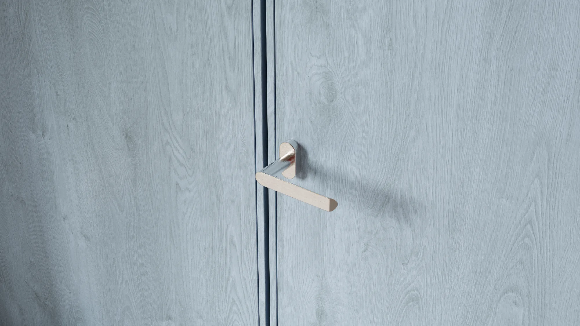Architectural detail of minimalist stainless steel door handle on blue-stained wood panel