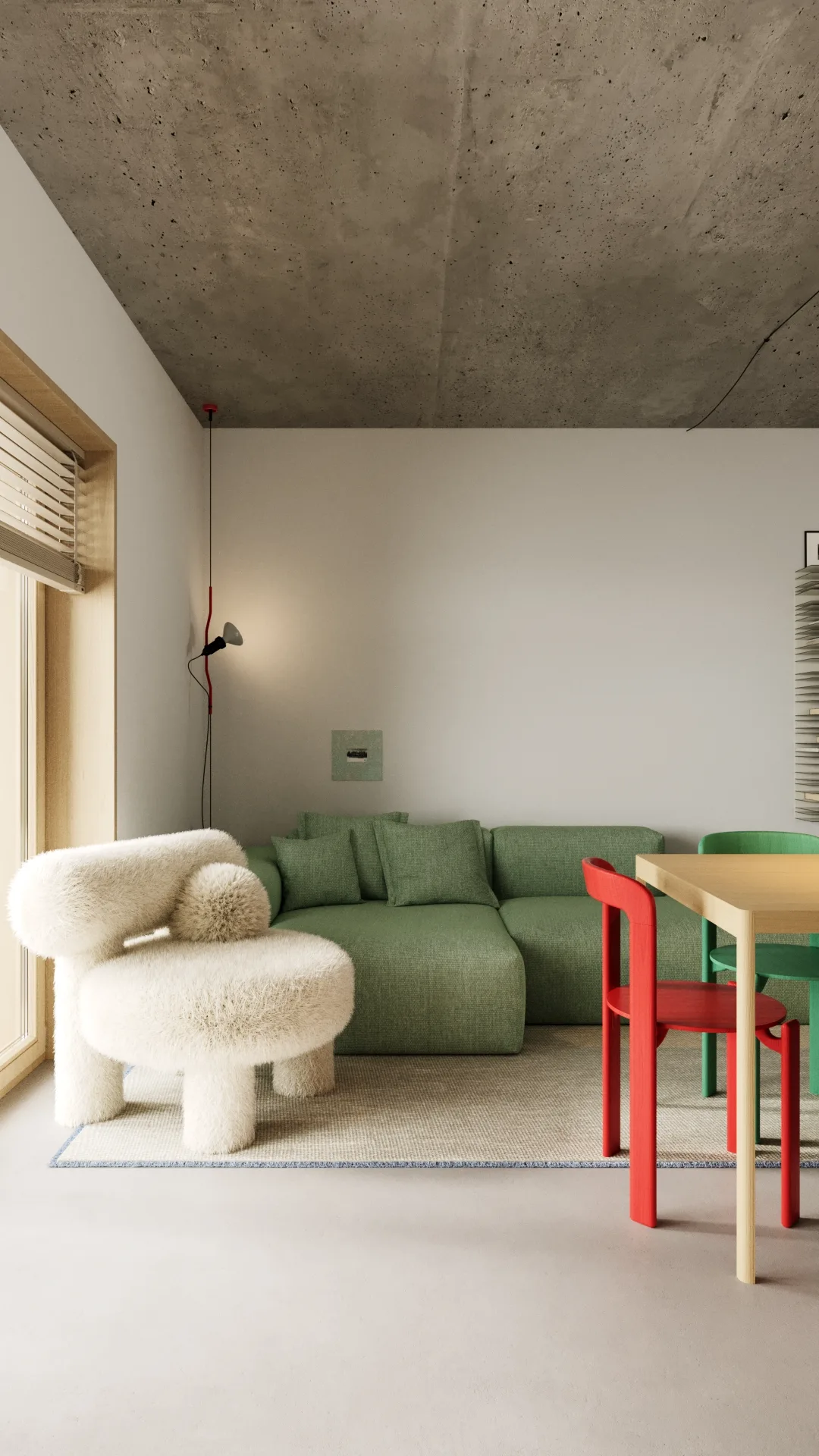 Living room corner with white bouclé accent chair, green modular sofa, and exposed concrete ceiling