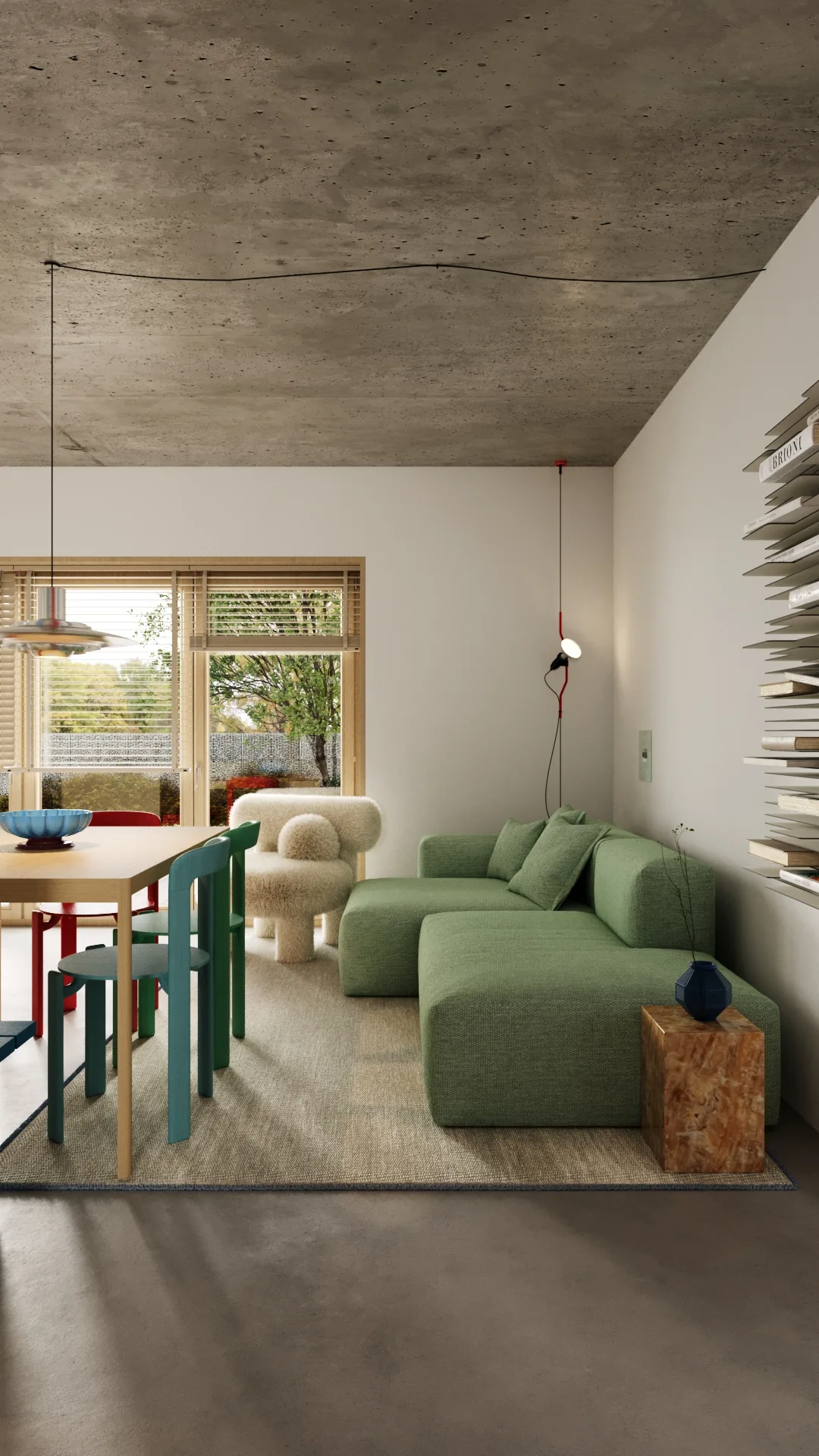 Open living room with green corner sofa, wooden dining table, and large window opening to the garden